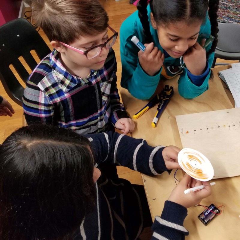 Children learning at the electric girls event